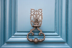 blue exterior door with door knocker